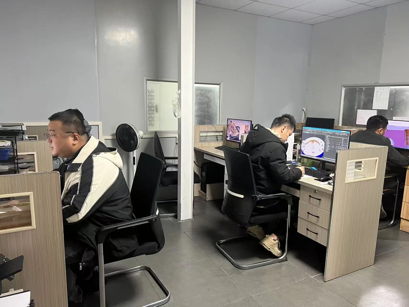 DFocus engineering office reviewing manufacturing projects