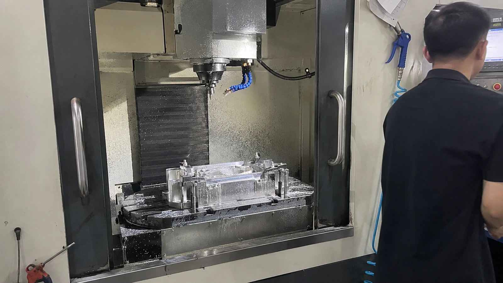 CNC machine cutting an aluminum prototype part