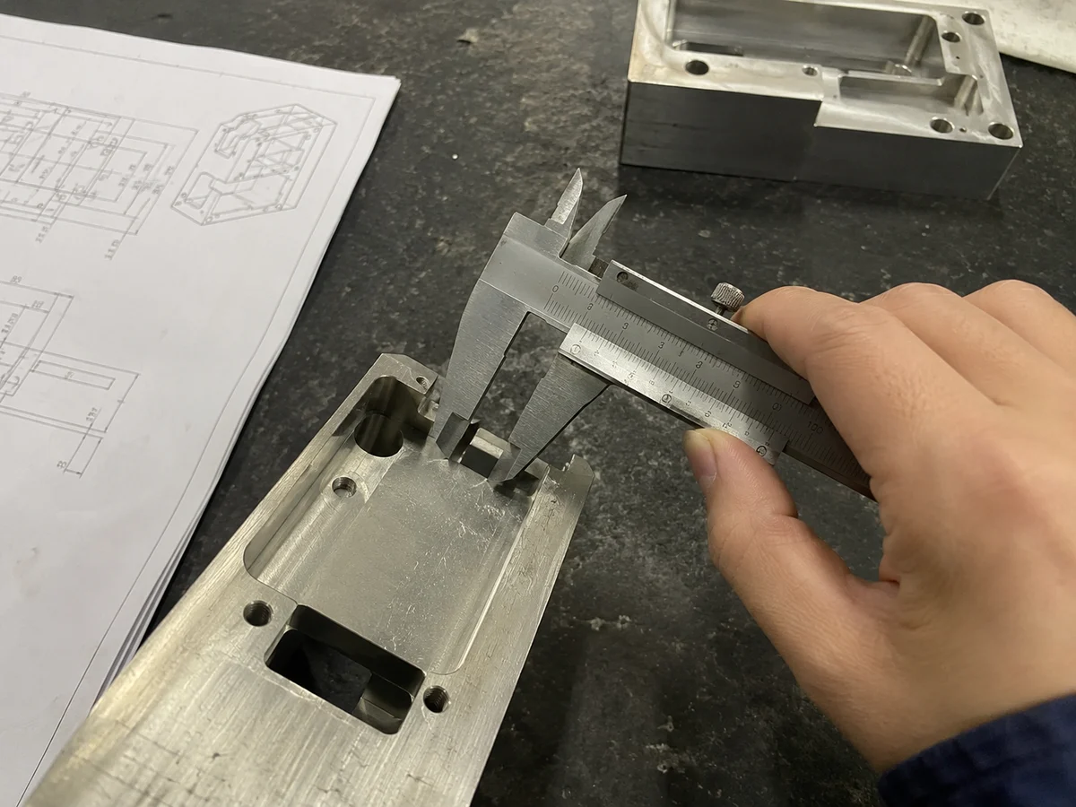 Caliper checking a prototype part dimension